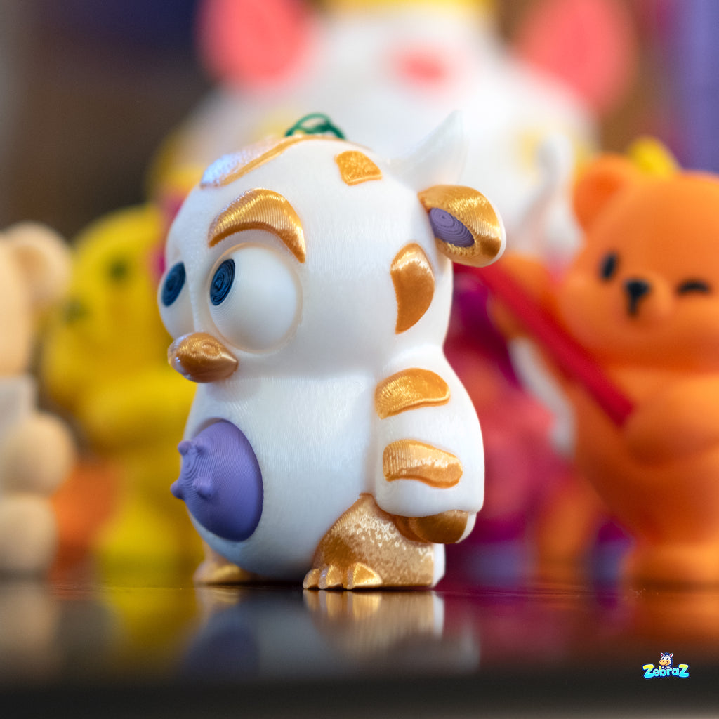 "Golden Cow Keychain Charm - Cute 3D Printed Collectible"